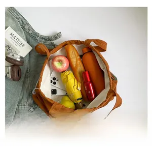 Close-up of caramel tote bag interior showing large capacity for daily essentials