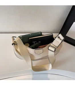 Top view of cream crossbody bag interior showing spacious room for essentials