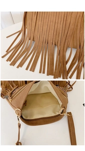 Detail of brown suede tassel bag featuring ethnic embroidery and interior zipper pocket
