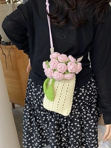 Handmade knitted crossbody phone bag with 3D pink floral rose accents and thin straps