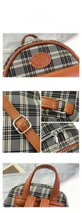 Close-up of vintage plaid backpack showing woven fabric texture and leather handles