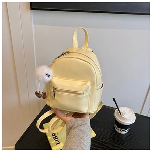 Mini cream yellow PU leather backpack with cute plush charm and zipper pockets