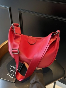 Chic red hobo shoulder bag with adjustable strap and smooth finish for stylish women