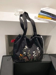 Retro black canvas tote bag with floral embroidery and drawstring closure for women