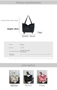 Detail view of denim tote bag with bow accent in white, black and pink colors
