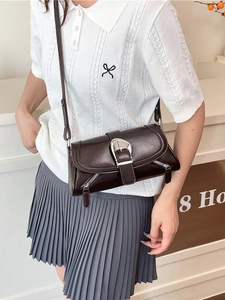 Deep brown retro crossbody bag with large silver buckle and side zipper details