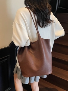 Brown lychee textured leather tote bag with long shoulder straps for women
