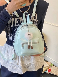 Mini mint green patent leather backpack for women with cute plush eye pendant