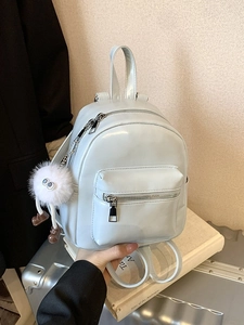 Light blue mini leather backpack with cute monster charm and double zipper design