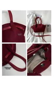 Detail view of burgundy matte suede bucket bag with magnetic closure and herringbone lining