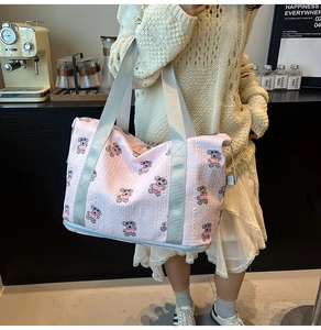Pink cartoon bear tote bag in bubble cotton fabric shown in a lifestyle cafe setting