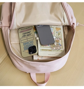Top view of the pink backpack open main compartment showing spacious interior capacity