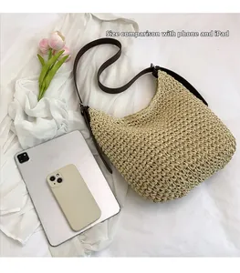 Detailed size comparison of the woven straw tote bag with an iPad and smartphone