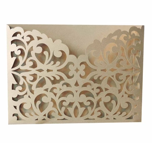 Laser-cut champagne gold bridal shower invitation with intricate scrollwork and vine pattern