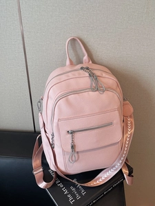 Pink lychee grain leather backpack with multi-zipper compartments and patterned strap