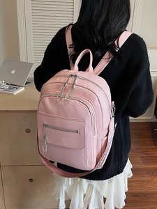 Pink lychee texture leather backpack for women featuring stylish silver chain and large capacity