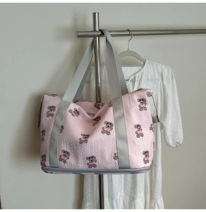 Pink cartoon travel bag with teddy bear print and 3D textured pleated fabric surface