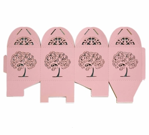 Flat pink laser-cut candy box featuring hollow tree design for holiday parties