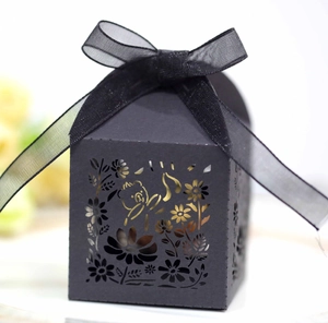 Detailed laser-cut black gift box featuring a cute cat and floral pattern with a ribbon