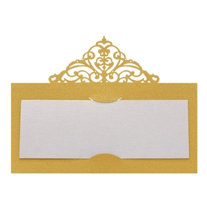 Detail of laser-cut gold pearlescent table card with intricate baroque hollow patterns