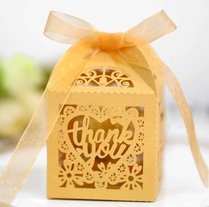 Golden laser-cut heart favor box with thank you text and sheer ribbon for weddings