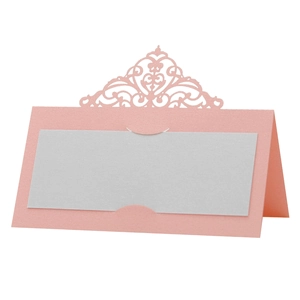 Pink laser-cut wedding table place card featuring an intricate crown lace pattern