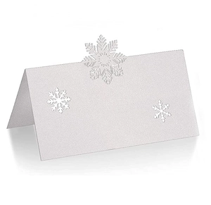 Detailed view of silver white snowflake laser-cut table card with pearlescent finish