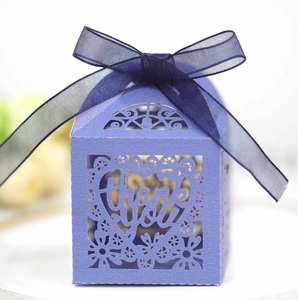 Detail of laser cut purple candy box with Thank You text and blue organza ribbon