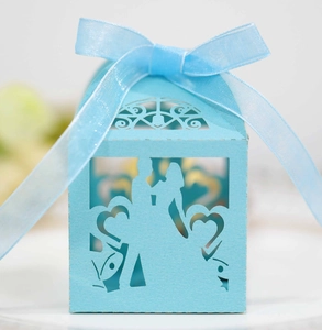 Sky blue laser-cut wedding favor box with bride groom silhouette and ribbon bow