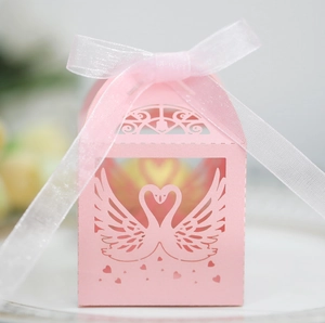 Pink laser cut wedding gift box featuring hollow swan heart design and organza ribbon