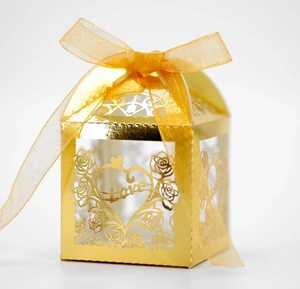 Hollow gold wedding favor box with laser-cut rose patterns and heart Love ribbon