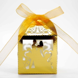 Hollow laser cut wedding candy box in gold mirror finish with bride and groom silhouette