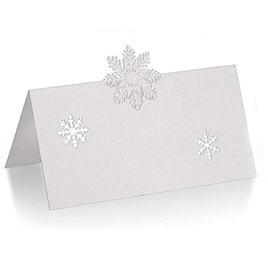 White laser cut snowflake place cards with shimmer pearl paper for Christmas wedding table