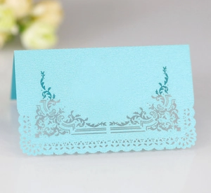 Light blue laser cut lace wedding place card made of pearlized paper with vine patterns