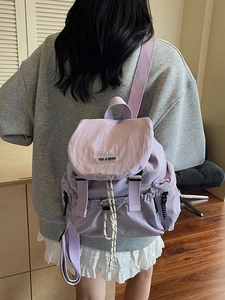 Stylish lilac lightweight backpack for women featuring a flap closure and buckle straps