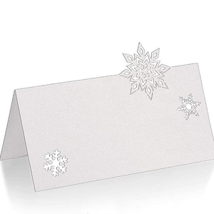 White laser cut snowflake place card for Christmas weddings and festive events