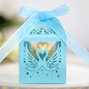 Light blue laser cut swan wedding candy gift box with elegant organza ribbon bow