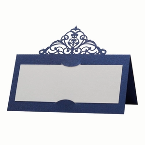 Detailed side view of laser-cut wedding place card in navy blue pearlescent paper