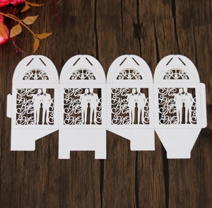 Detailed view of white laser-cut cardstock candy box template featuring Mr & Mr silhouettes