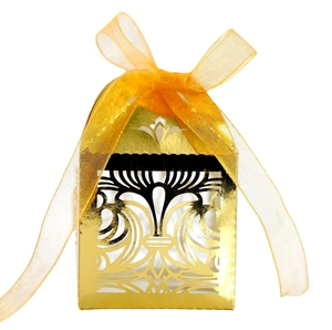 Elegant gold laser-cut hollow crown candy box with an orange satin ribbon bow