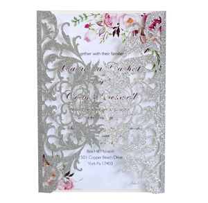 Detail of silver glitter laser cut floral cover and rose printed wedding invitation card