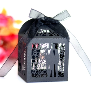 Detailed laser-cut Mr & Mrs wedding candy box in black with a satin ribbon bow