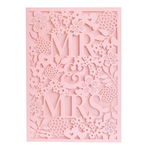 Detailed laser-cut pink wedding invitation card with floral patterns and Mr & Mrs text