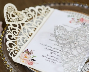 Laser cut heart wedding invitation with glitter finish and watercolor floral insert