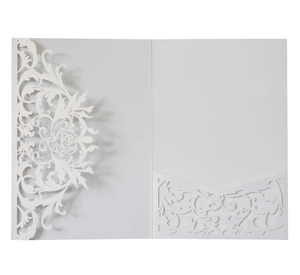 Detailed laser-cut rose patterns on white pearlescent paper wedding invitation cover