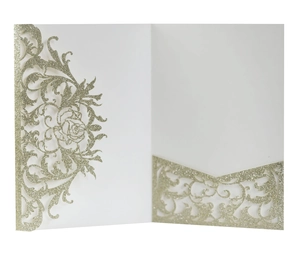 Detail of laser-cut wedding invitation with gold glitter rose patterns and elegant cutouts