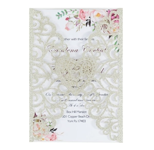 Detail of silver glitter laser-cut heart invitation cover with floral printed inner card