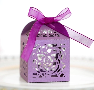 Detailed laser-cut purple candy box with elegant rose pattern and silk ribbon bow