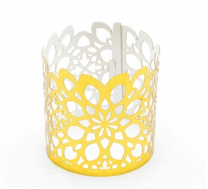 Detailed macro view of laser-cut gold mandala metal napkin ring with white inner coating