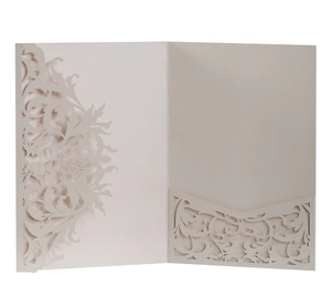 Detailed laser-cut vine patterns on pearl paper wedding invitation pocket fold